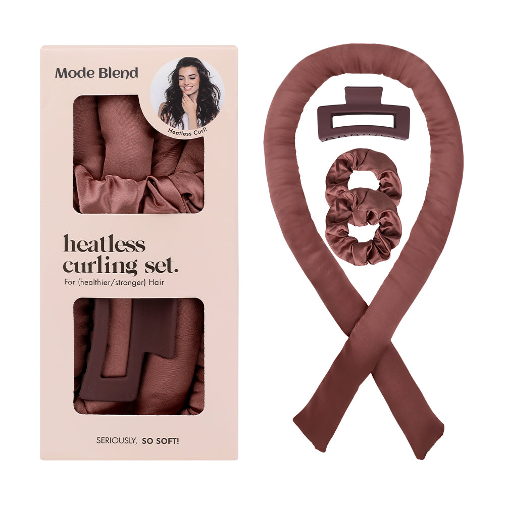 Flat lay of the MODE BLEND heatless curling rod set with scrunchies and a hair care guide.